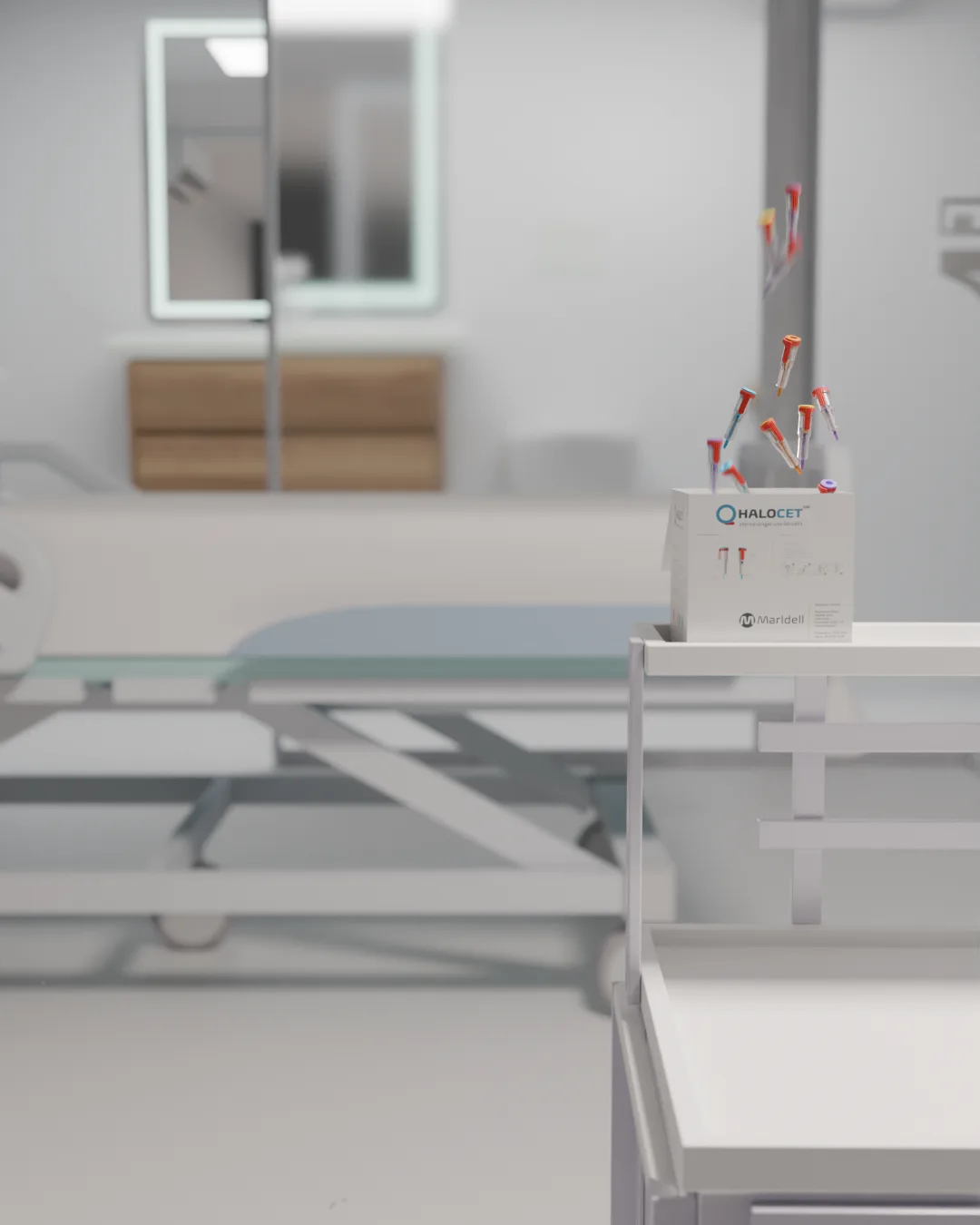 A Halocet box sits on a hospital trolley, an examination room blurred behind it.