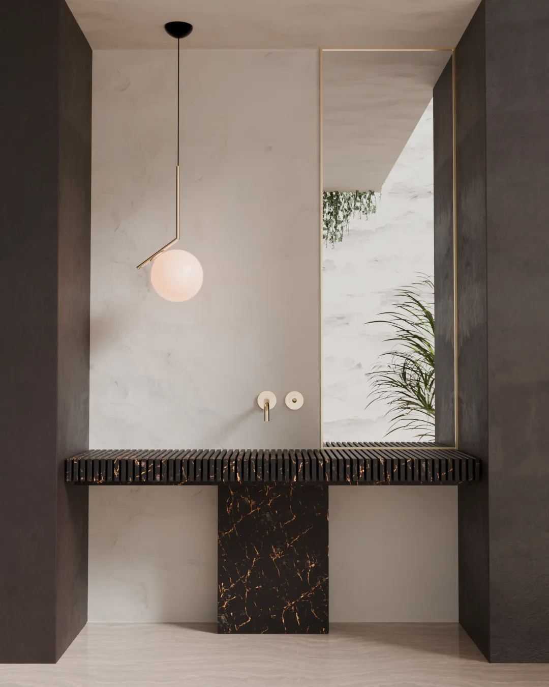 A globe pendant light hangs beside a black fluted marble sink and a mirror framing a potted plant.