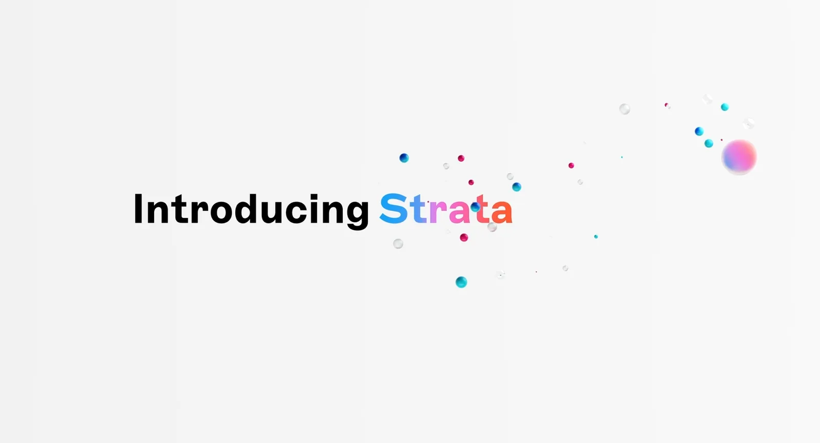 Title card 'Introducing Strata' in gradient lettering, small glossy spheres scattered around it.